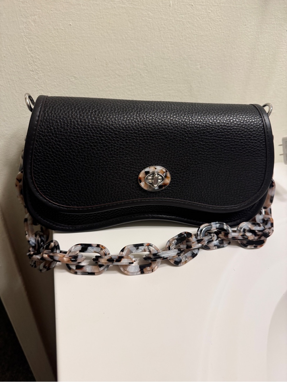 Coachtopia Black Pebbled Crossbody Bag with Tortoiseshell Acrylic Chain